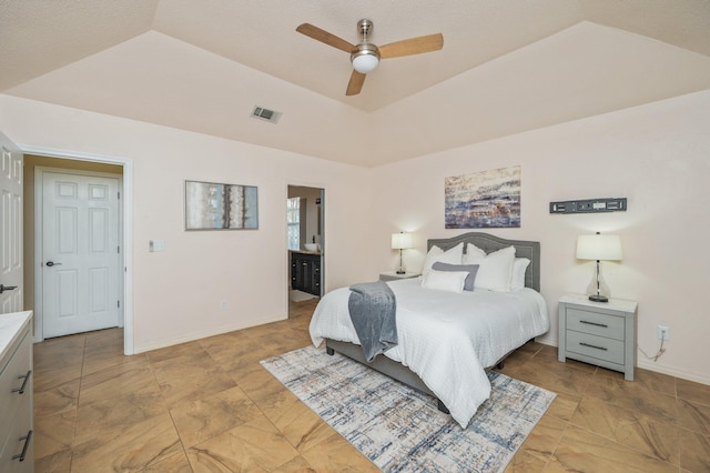 1905 W Mistral Ln, Fort Walton Beach, FL 32547 - bedroom featuring connected bathroom, a raised ceiling, ceiling fan, and stone finish floors