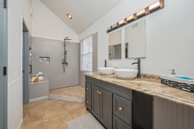 1905 W Mistral Ln, Fort Walton Beach, FL 32547 - bathroom featuring a walk in shower, double vanity, and lofted ceiling