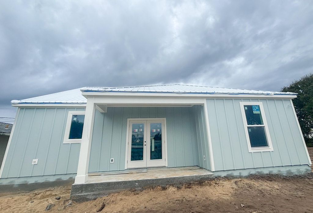 back of house featuring french doors