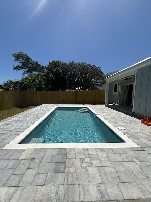 view of pool featuring a fenced in pool, a fenced backyard, and a patio area
