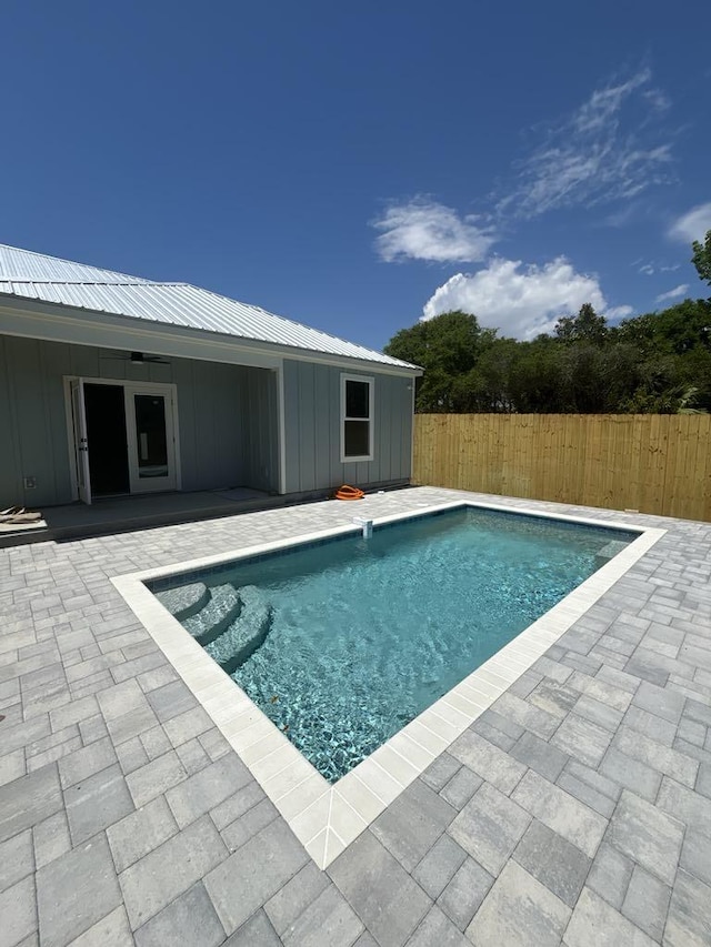 view of pool with a patio, a fenced backyard, and a fenced in pool