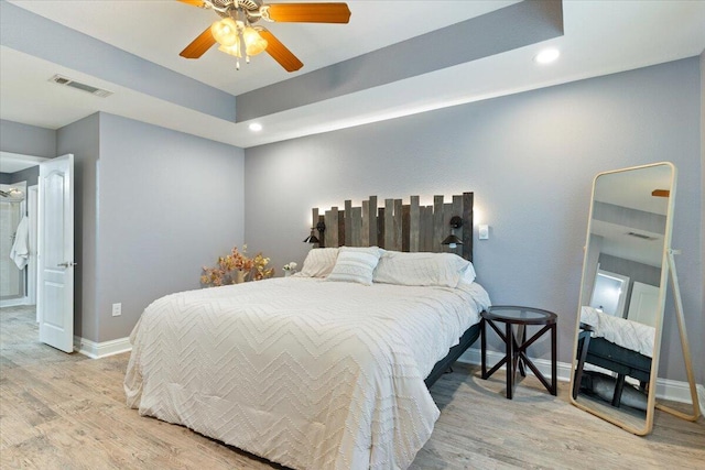 bedroom with ceiling fan and light hardwood / wood-style flooring