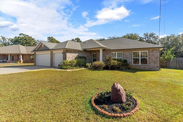 single story home featuring a garage and a front yard