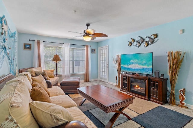 living room featuring light wood-type flooring and ceiling fan