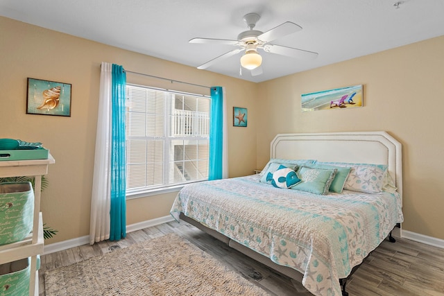 bedroom featuring ceiling fan and hardwood / wood-style floors