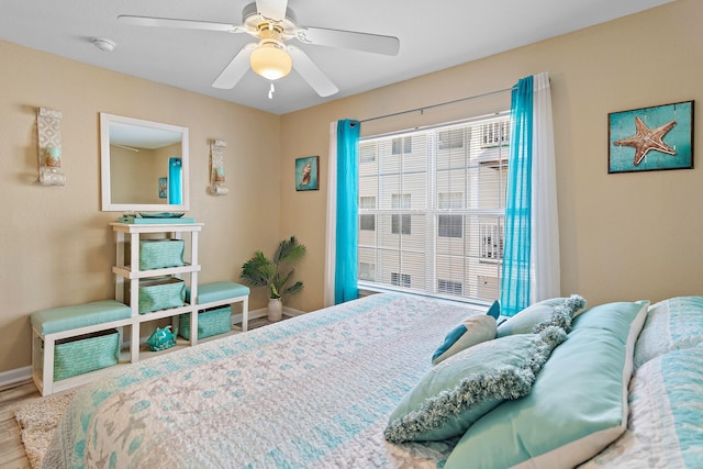 bedroom featuring hardwood / wood-style flooring and ceiling fan