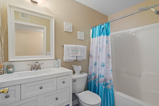 full bathroom featuring vanity, shower / bathtub combination with curtain, a textured ceiling, and toilet