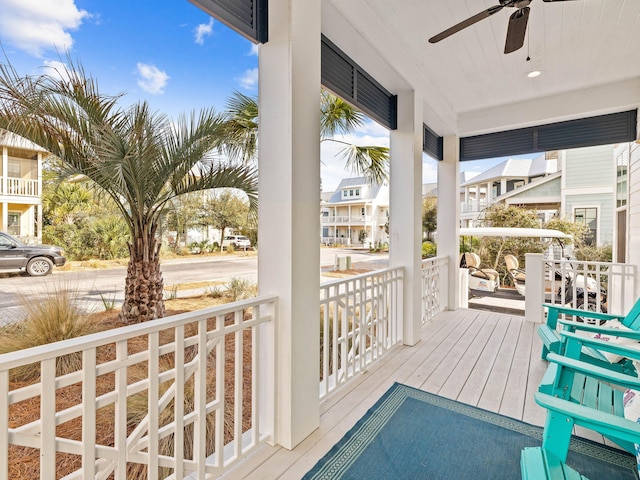 deck featuring ceiling fan and a porch