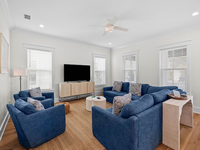 living room featuring light hardwood / wood-style floors, plenty of natural light, and ceiling fan