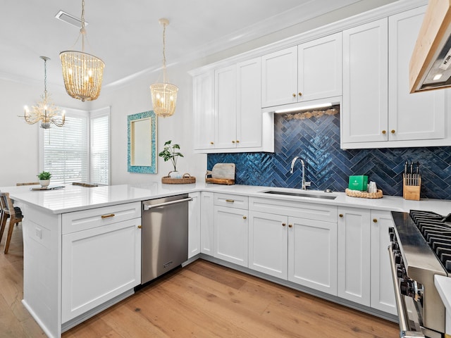 kitchen with kitchen peninsula, white cabinetry, hanging light fixtures, and light wood-type flooring