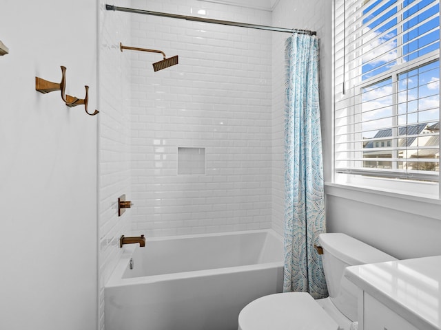 bathroom featuring shower / bath combo and toilet