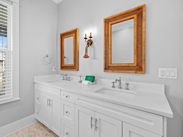 bathroom featuring tile patterned flooring and vanity