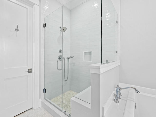 bathroom with separate shower and tub