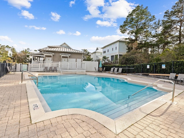 view of swimming pool with a patio