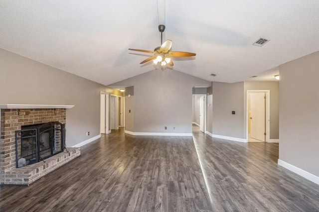 unfurnished living room featuring ceiling fan, dark hardwood / wood-style flooring, a fireplace, and vaulted ceiling