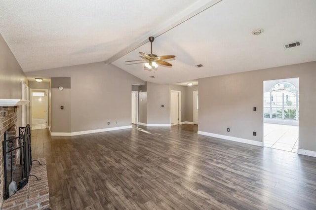 unfurnished living room with dark hardwood / wood-style flooring, ceiling fan, a fireplace, and lofted ceiling