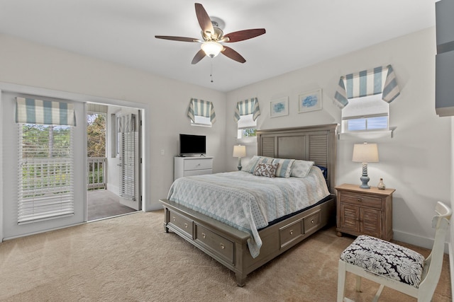 carpeted bedroom featuring access to exterior and ceiling fan