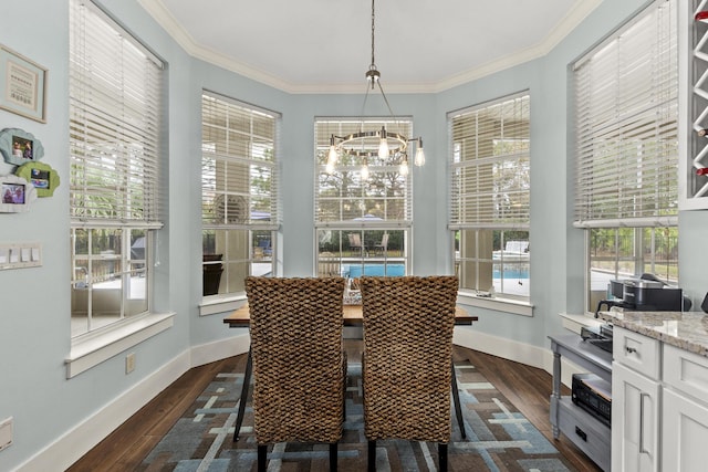 dining room with crown molding and dark hardwood / wood-style floors