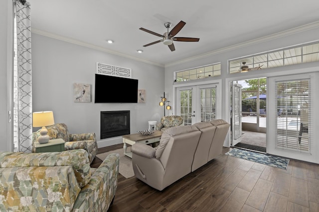 living room featuring ornamental molding, ceiling fan, dark hardwood / wood-style flooring, and french doors