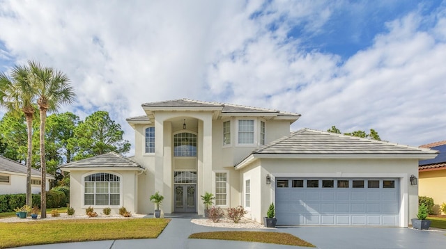 mediterranean / spanish house featuring a garage