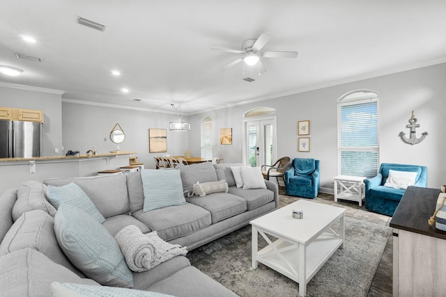 living room featuring french doors, ceiling fan, and ornamental molding