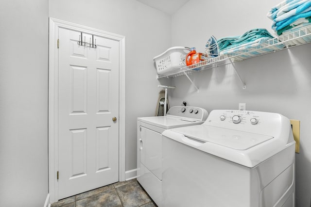 washroom featuring washing machine and clothes dryer