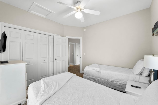 carpeted bedroom with ceiling fan and a closet