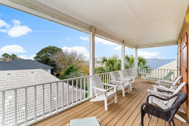 wooden terrace with a water view