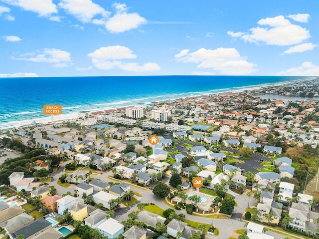 birds eye view of property featuring a view of the beach and a water view