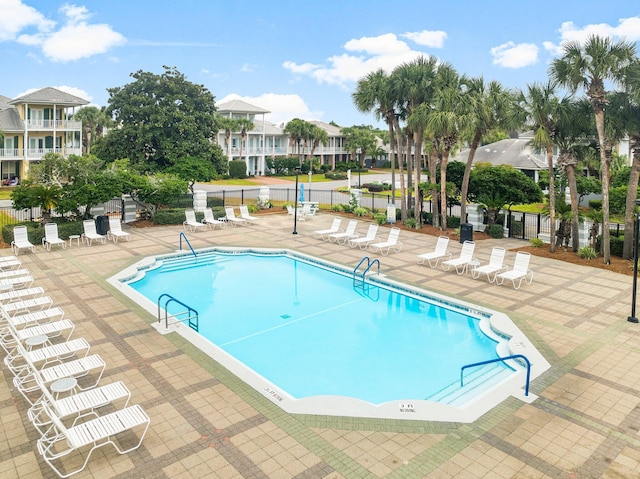 view of swimming pool with a patio