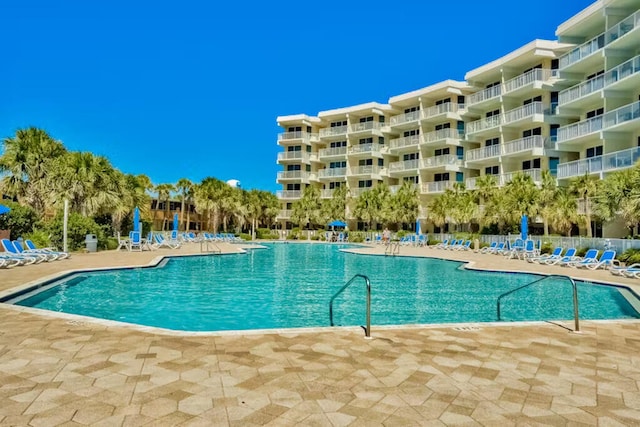 view of swimming pool with a patio