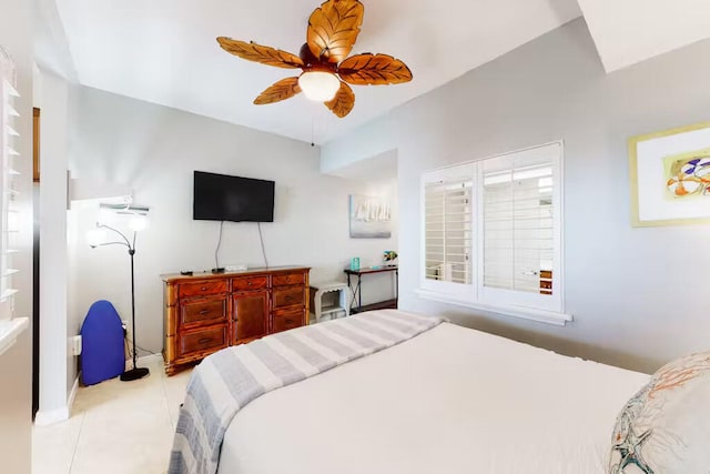 tiled bedroom featuring ceiling fan