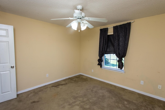 spare room with ceiling fan, carpet floors, and a textured ceiling