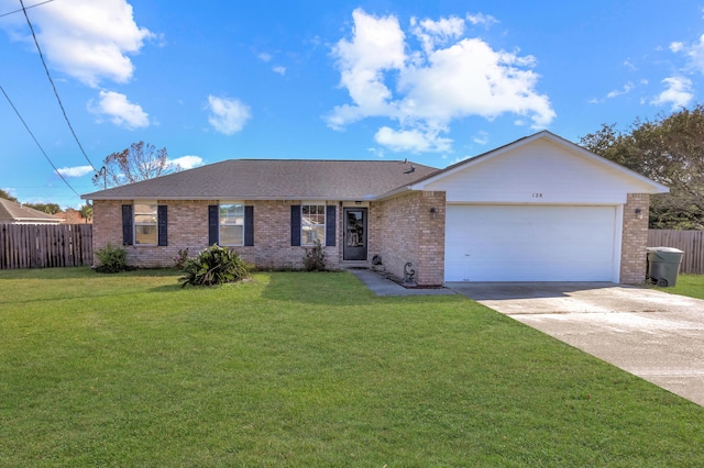 ranch-style home with a front lawn and a garage