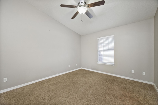 empty room with a textured ceiling, ceiling fan, carpet, and vaulted ceiling