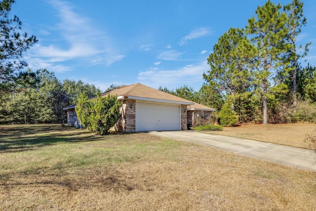 ranch-style home with a garage and a front lawn