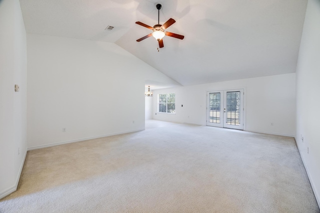 8180 Shooter Ln, Laurel Hill, FL 32567 - spare room with a chandelier, ceiling fan, lofted ceiling, light colored carpet, and french doors