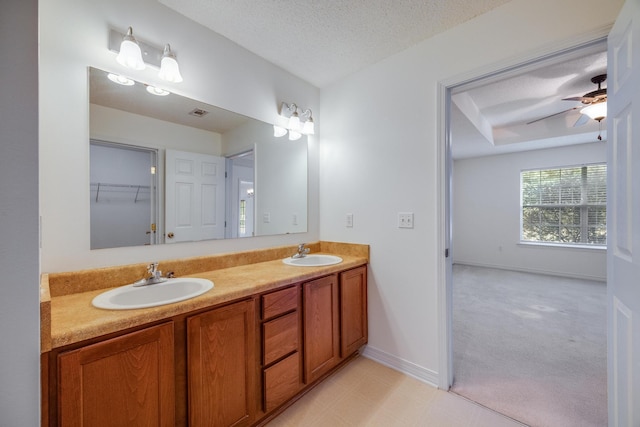 8180 Shooter Ln, Laurel Hill, FL 32567 - full bath featuring double vanity, baseboards, a textured ceiling, and ceiling fan