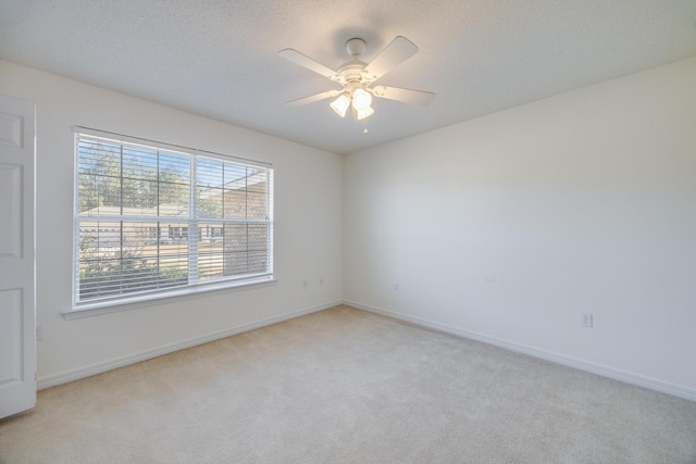 8180 Shooter Ln, Laurel Hill, FL 32567 - empty room featuring light carpet, a textured ceiling, and ceiling fan