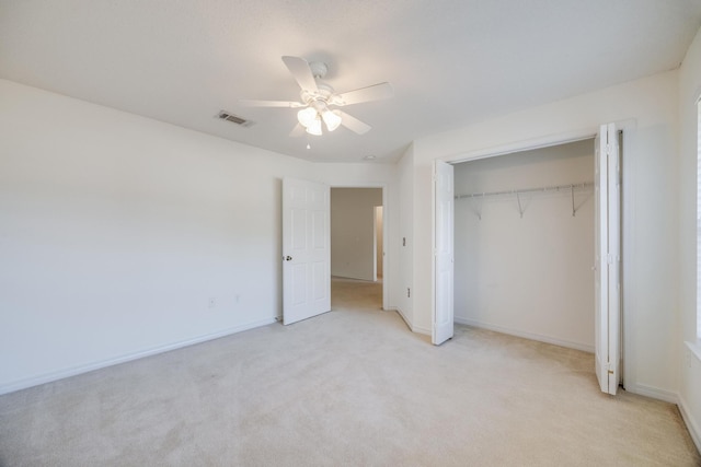 8180 Shooter Ln, Laurel Hill, FL 32567 - unfurnished bedroom featuring a closet, light colored carpet, and ceiling fan