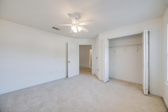 8180 Shooter Ln, Laurel Hill, FL 32567 - unfurnished bedroom featuring light carpet, a closet, baseboards, and ceiling fan