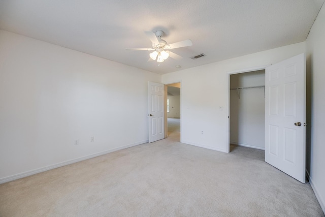 8180 Shooter Ln, Laurel Hill, FL 32567 - unfurnished bedroom featuring light carpet, baseboards, ceiling fan, and a closet