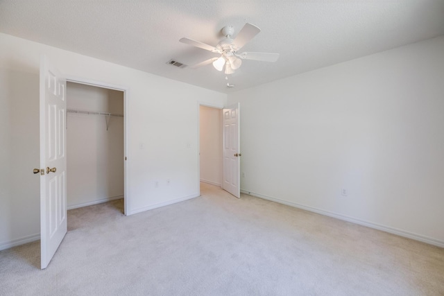 8180 Shooter Ln, Laurel Hill, FL 32567 - unfurnished bedroom with light colored carpet, a ceiling fan, a closet, and baseboards