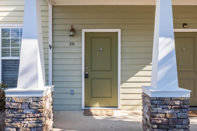 doorway to property with a porch