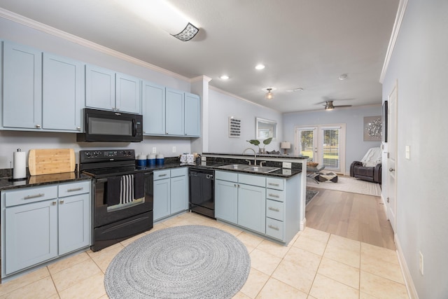 kitchen featuring black appliances, crown molding, sink, light tile patterned floors, and kitchen peninsula