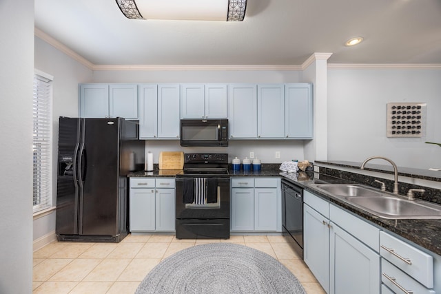 kitchen featuring sink, crown molding, dark stone counters, light tile patterned flooring, and black appliances