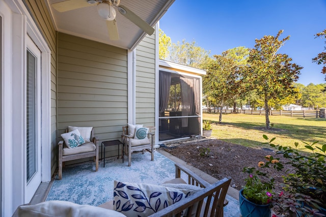 view of patio featuring ceiling fan