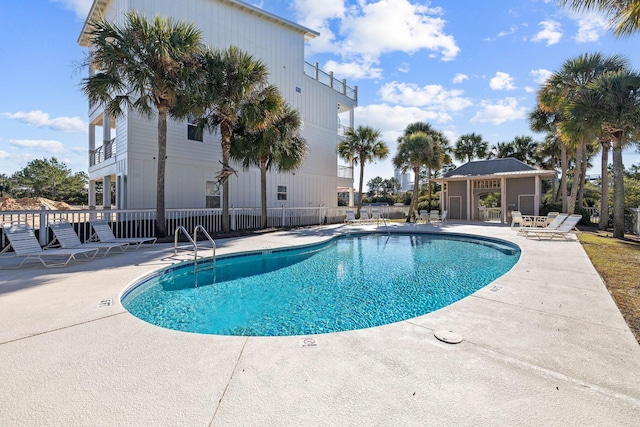 view of swimming pool featuring a patio area