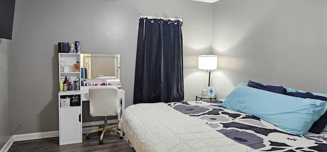 bedroom featuring dark wood-type flooring