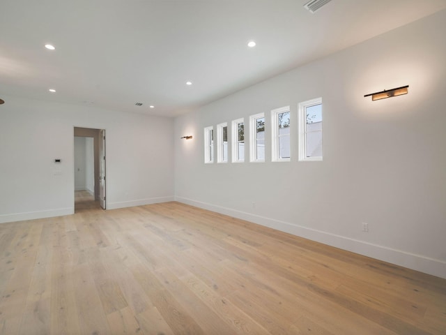 spare room with light wood-type flooring